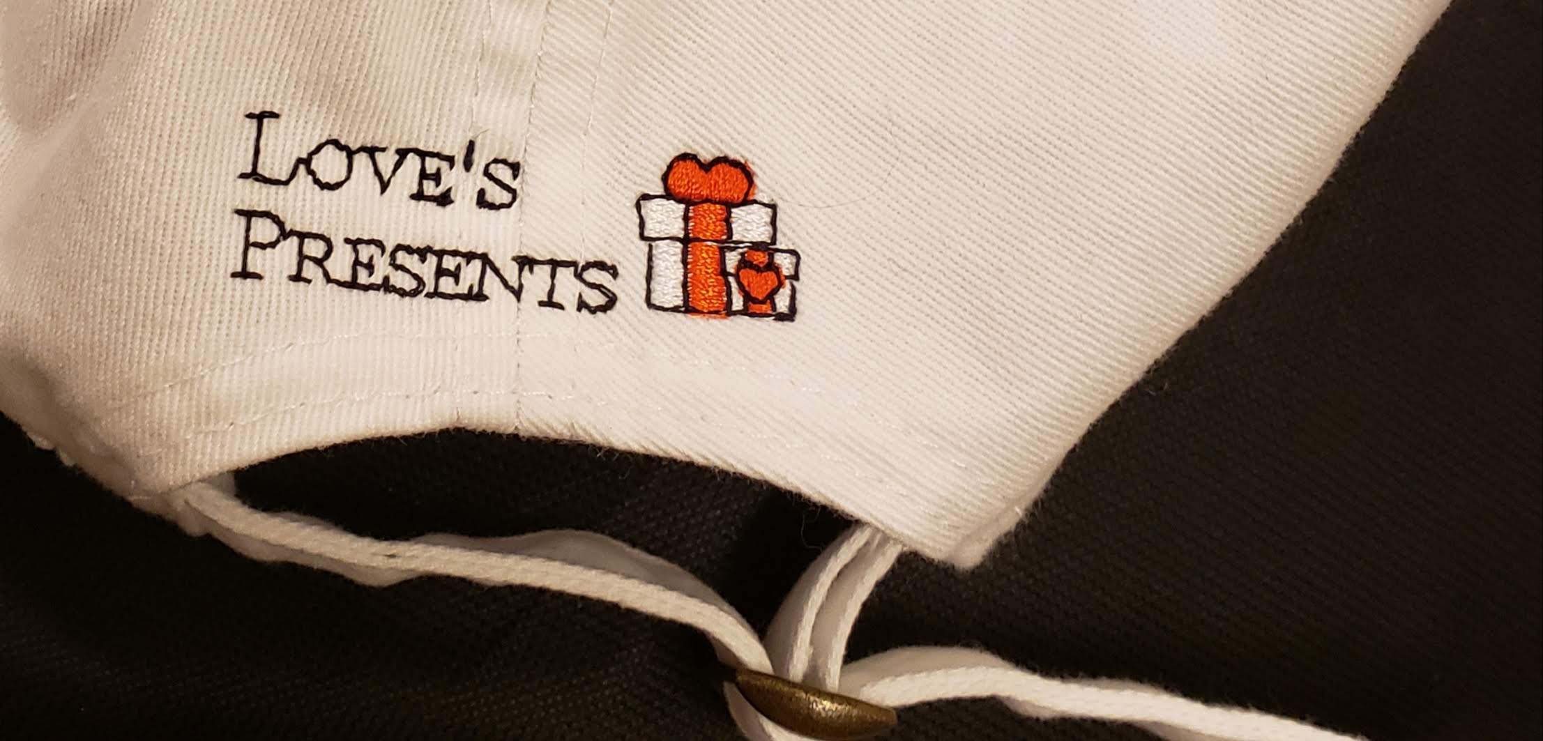 loves presents with logo embroidered on cap